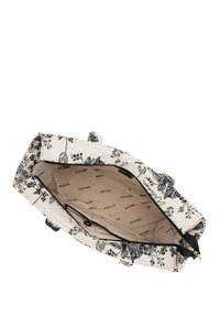 Sac tote en toile avec motif floral noir, fermeture zippée et doublure intérieure affichant un imprimé logo. Spacieux avec des poignées doubles.