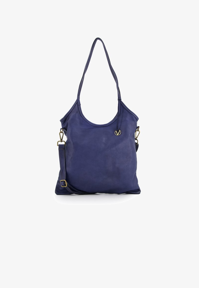 Navy leather tote bag with two shoulder straps, smooth texture, a rounded top, and a small gold logo accent on the front.