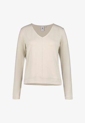 Hellbeige Langarmoberteil mit V-Ausschnitt, aus weichem Stoff, mit geradem Saum und mittiger Nahtdetails. Schlichtes Design und Textur.