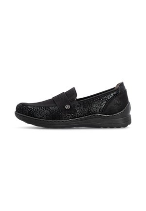 Chaussure noire à enfiler avec motifs floraux, semelle compensée basse et petit bouton décoratif argenté sur la bride.