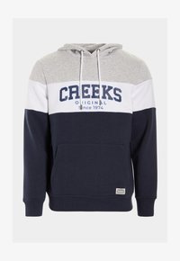 Sudadera azul marino y gris con un bolsillo frontal, rayas blancas y azul marino, y "CREEKS ORIGINAL desde 1974" impreso en el pecho. Material de mezcla de algodón.