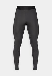 Leggings compressivi realizzati in un tessuto nero elasticizzato con un design aderente. Presentano un'ampia fascia in vita e dettagli di cucitura a contrasto.