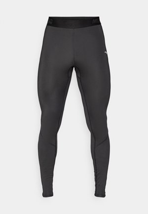 Legginsy kompresyjne wykonane z elastycznej czarnej tkaniny o dopasowanym kroju. Posiadają szeroki pas w talii oraz kontrastowe detale szwów.