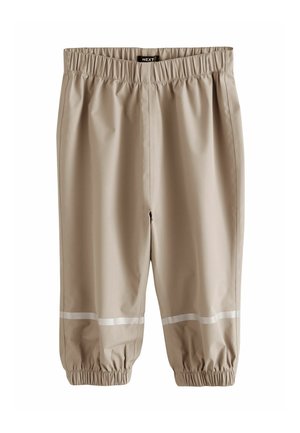 Drapp vízálló nadrág rugalmas derékrésszel és fényvisszaverő csíkokkal a rugalmas mandzsetták közelében.