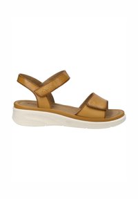 Brune lædersandal med to justerbare remme, en polstret sål og en let hvid sål. Simpelt design med en glat tekstur.