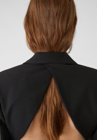 Stradivarius PLAY WITH A LOW-CUT BACK - Haalari - black