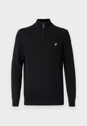 Pulover negru cu guler tip fermoar, fabricat dintr-un material neted, având mâneci lungi și un mic logo galben pe pieptul stâng.