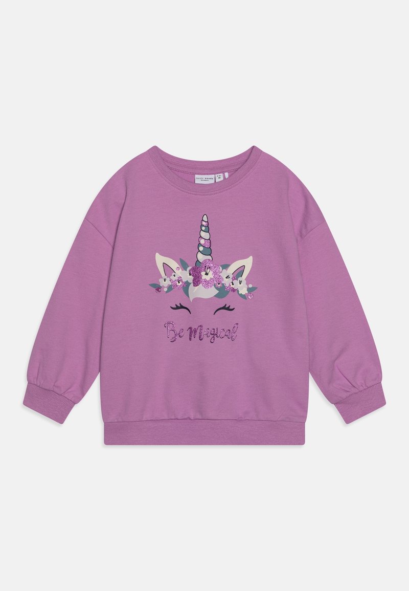 Sweat-shirt violet avec un motif de licorne orné de fleurs et le texte « Be Magical » en paillettes. Poignets et ourlet côtelés.