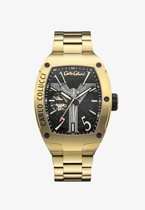 Goldfarbene Metall-Uhr mit rechteckigem Gehäuse, schwarzem geprägtem Zifferblatt, weißen Stundenmarkierungen und sichtbaren Details der mechanischen Bewegung.