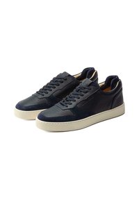 Navy sneakers featuring a mix of smooth and textured leather, rounded toe, flat laces, and a contrasting light rubber sole.