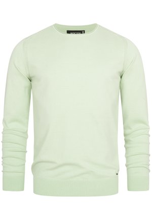 Maglione crewneck verde chiaro realizzato in tessuto morbido, con polsini e orlo a coste e dettagli delle cuciture lungo le spalle.