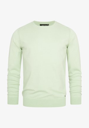 Light green crewneck sweater made of soft fabric, featuring ribbed cuffs and hem, with seam details along the shoulders.