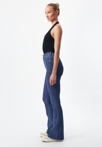 Dr.Denim MOXY FLARE - Flared jeans - cape dark plain