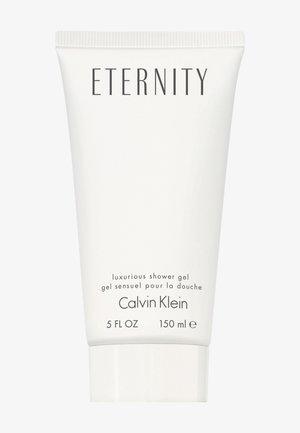 Tube blanc de gel douche, 150 ml, étiqueté "Eternity" avec description du produit et nom de la marque "Calvin Klein" en lettres noires.