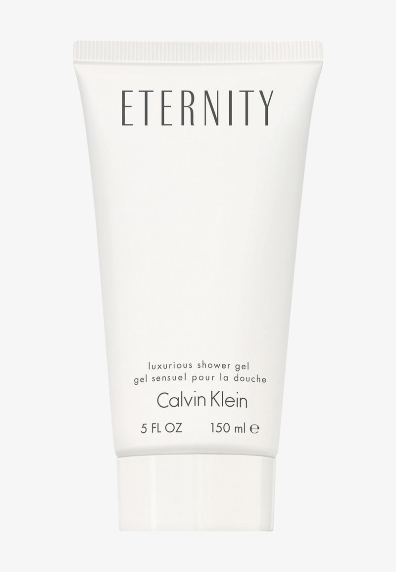 Vit tub med duschgel, 150 ml, märkt "Eternity" med produktbeskrivning och varumärket "Calvin Klein" i svarta bokstäver.