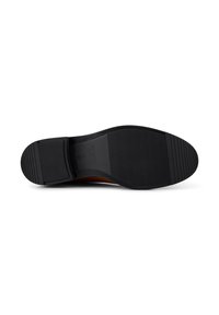 Semelle noire de chaussure avec caoutchouc texturé pour l'adhérence, dotée d'un léger talon, d'un bord lisse et d'un logo près de la zone de la voûte.