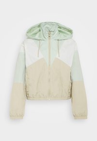 Lekka, krótka kurtka w miętowym, kremowym i beżowym kolorze. Posiada kaptur, zamek z przodu oraz elastyczne mankiety z geometrycznym wzorem kolorowych bloków.