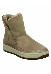 Hellbraune Leder-Stiefeletten mit einem weichen, tanfarbenen Futter aus Fell und einer weißen Gummisohle. Elegantes Design mit umklappbarem Schaft und minimaler Naht.