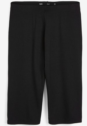 Fekete leggings rugalmas pamut anyagból, egyszerű dizájnnal, elasztikus derékpánttal és térdíméretű fazonnal. Nincsenek minták vagy kiegészítők.