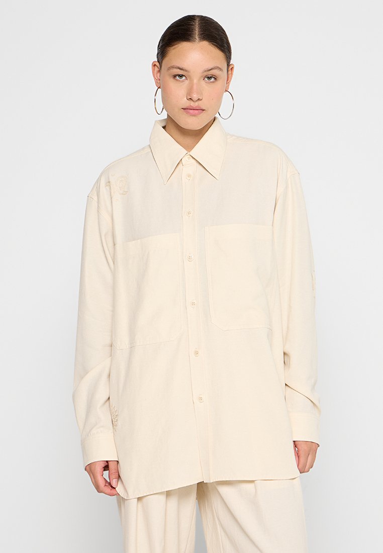 Nanushka Overhemdblouse beige Nanushka Overhemdblouse beige