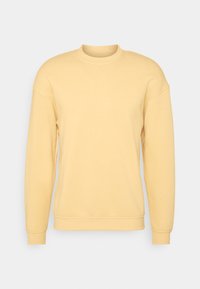 Gele sweatshirt met een ronde hals, lange mouwen en ribgebreide boorden. Gemaakt van stof die zacht aanvoelt met een gladde textuur. Klassiek casual ontwerp.
