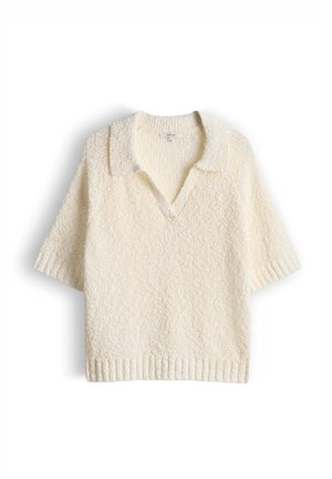 Pull en maille texturée de couleur crème à manches courtes avec col et ouverture en V, présenté sur un fond blanc.