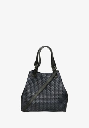 Grand sac fourre-tout tissé en bleu marine foncé, avec une surface texturée, des anses en cuir noir et une bandoulière amovible.