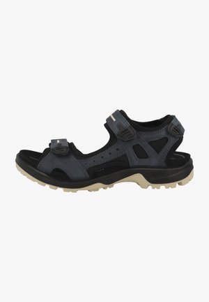 Men's outdoor sandals in dark grey and black. Made of synthetic materials, featuring adjustable straps, perforated design, and textured sole.