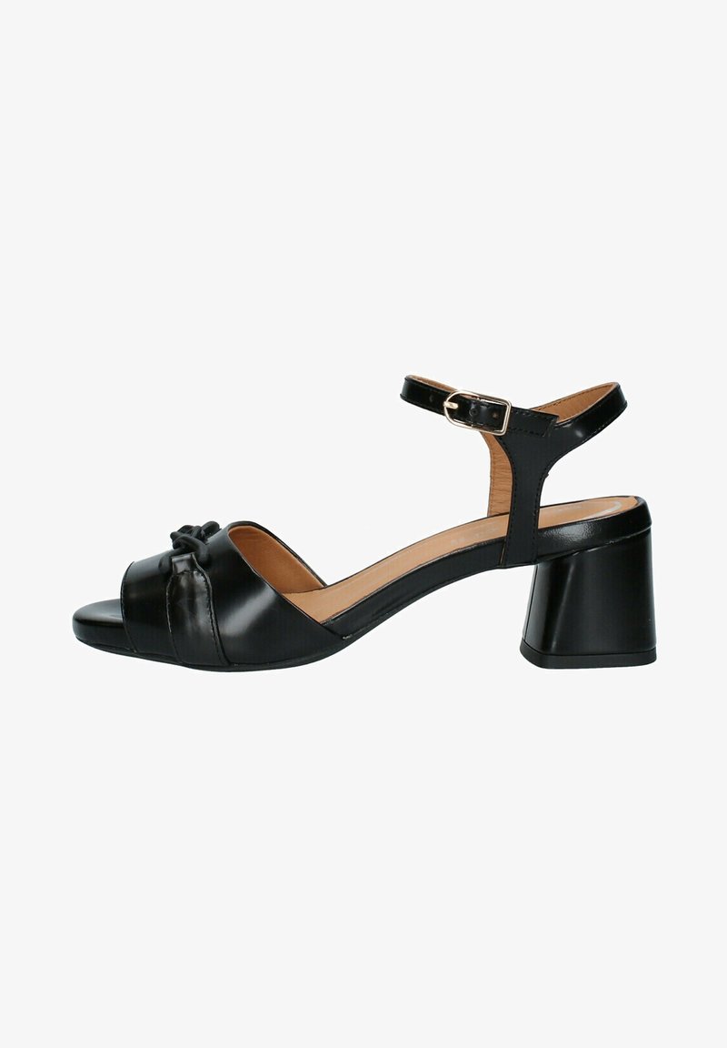 Sandale en cuir noir à bout ouvert, talon bloc, bride de cheville avec boucle et nœud décoratif sur la bride avant.