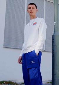 Nike Sportswear AIR WINTER PANT - Cargo trousers - deep royal blue/white
