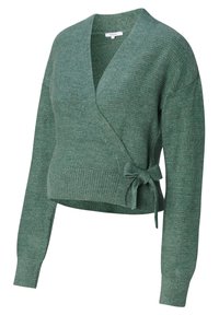 Grön slipover med långa ärmar, texturerat stickat material, V-ringning och en knytning i midjan. Kortsittande design.