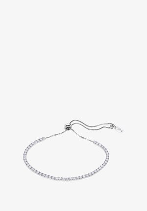 Bracelet ajustable en argent avec une rangée de pierres claires serties dans une chaîne délicate et élégante, dotée d'un fermoir rond et d'une étiquette avec logo.