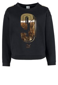 Sweat-shirt noir avec un grand motif "91" métallique doré sur le devant. Tissu doux avec col rond et manches longues, comprenant des accents aux épaules.