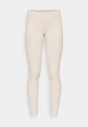 Světle béžové žebrované legíny se hladkým páskem a přiléhavým střihem, s plnou délkou a jemnou texturou.