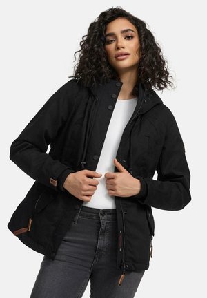Black hooded jacket with a zip and snap button closure, featuring adjustable drawstrings, multiple pockets, and textured fabric accents.