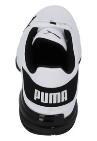 White sneakers with a black elastic band at the heel displaying "PUMA" in white, featuring a rounded toe and textured surface design.