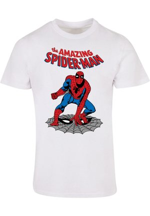 Vit bomullströja med en röd och blå Spider-Man-grafik på ett svart nät, med texten "den FANTASTISKA SPIDER-MAN" ovanför bilden.