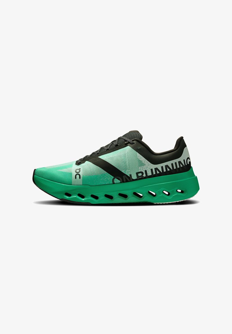 Green and black running shoe with a mesh upper, designed with cutouts in the sole and bold "ON RUNNING" text on the side.