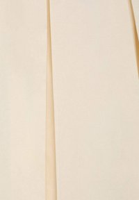 Beige fabric with a smooth texture, featuring two vertical panels. Lightly draping material with a subtle sheen and clean edges.
