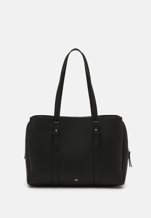 Black tote bag made of textured leather, featuring two long handles, a zip closure, and subtle gold accents on the hardware.