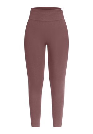 Leggings de talle alto en un suave color malva. Fabricadas con un material suave y elástico, con una textura lisa y forma ajustada. Sin patrones ni acentos visibles.