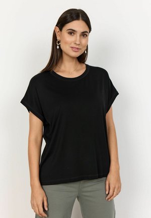 Black ribbed short-sleeve top with a round neckline, relaxed fit, and subtle stitching detail, paired with olive-green pants.