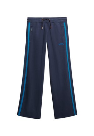 Pantalons de jogging larges navy avec des rayures latérales bleues, taille à cordon, poches latérales et petit logo "Superdry" sur la cuisse gauche.
