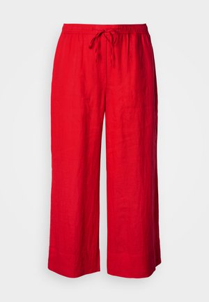 Red wide-leg pants with elastic waistband and front drawstring, made from lightweight fabric.