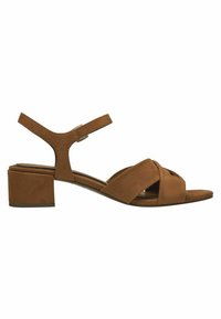 Brown suede sandal with a chunky heel, featuring a cross strap design and adjustable ankle strap for secure fit. Suitable for casual wear.