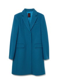 Teal wollen jas met een notch-kraag, twee voorzakken en een enkele split. Soepele binnenvoering in een complementair blauw.
