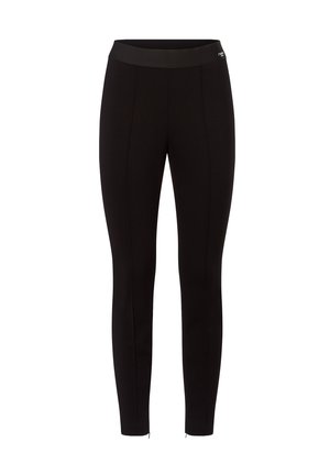 Schwarz taillierte Leggings mit hohem elastischem Bund und subtilen vertikalen Nähten auf der Vorderseite, ohne sichtbare Logos, außer am Taillenbund.
