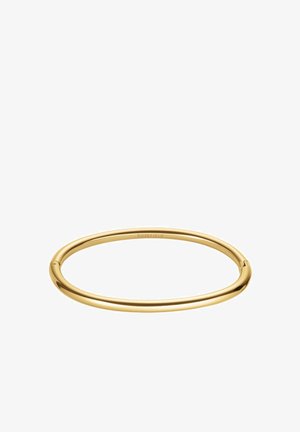 Bague en métal plaqué or avec un design rond et lisse, dotée d'un mécanisme de verrouillage subtil. Fini poli, style minimaliste.