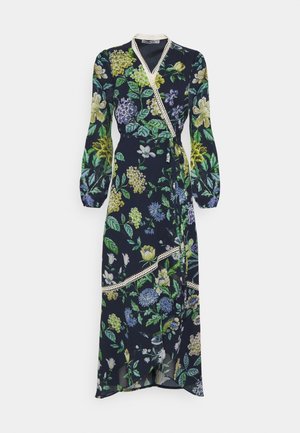 Kukka-kuvioinen kietaisumekko laivastonsinisellä pohjalla, vihreillä, keltaisilla ja purppuranvärisillä kukilla. Mekossa on pitkät hihat, pitsikoristeet ja sivun solmittava nauha. Kevyt kangas.