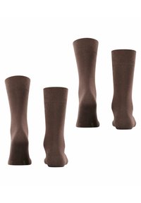 Braune Baumwollsocken mit einem gerippten Textur, in konturierter Form und mit weichen elastischen Bündchen an der Oberseite. Keine sichtbaren Muster oder Beschläge.